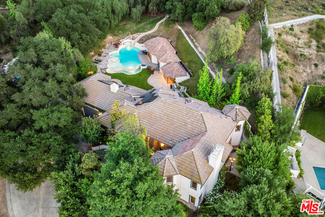 204 Bell Cyn Road Bell Canyon, CA 91307 - Photo 66 of 75 an aerial view of a house with yard and outdoor seating