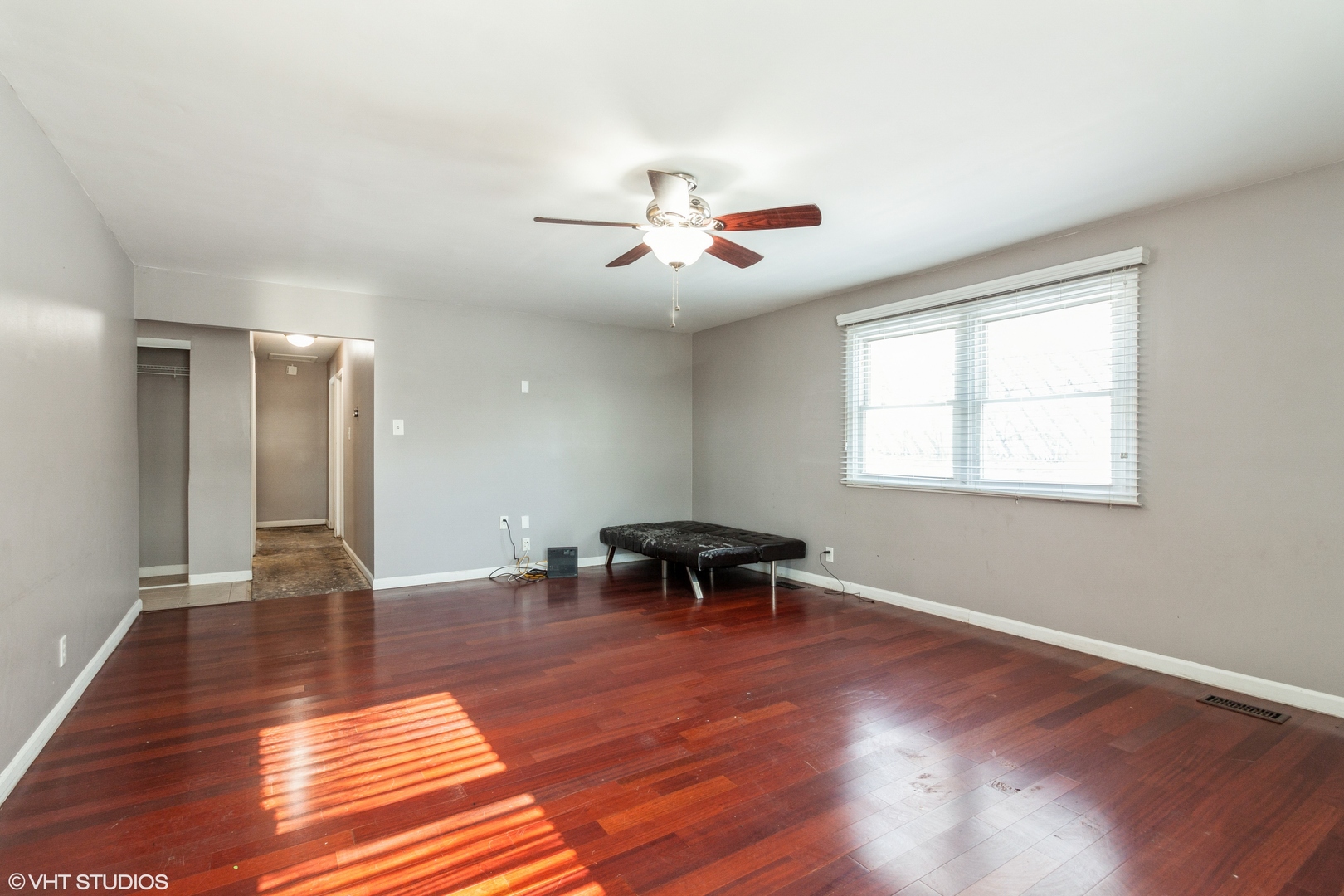 168 North Pinecrest Road Bolingbrook, IL 60440 - Photo 7 of 15 a view of a livingroom with furniture a ceiling fan and wooden floor