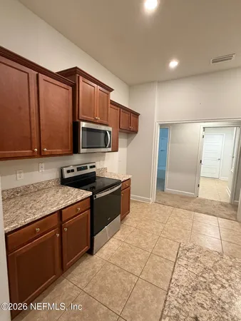 a view of a storage and utility room with racks on the wall