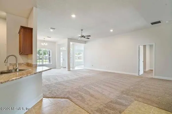 a view of empty room with windows