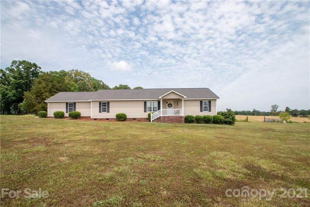 4417 Medlin Road Monroe, NC 28112 - Photo 2 of 30 a front view of a house with a garden