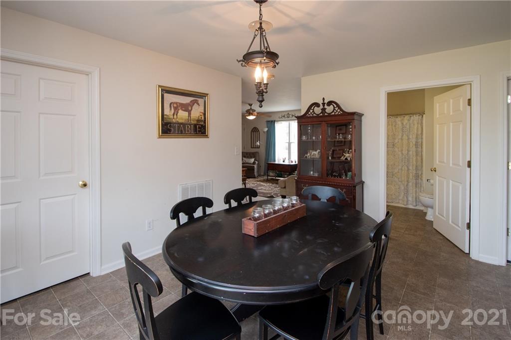 4417 Medlin Road Monroe, NC 28112 - Photo 13 of 30 a dining room with furniture and window