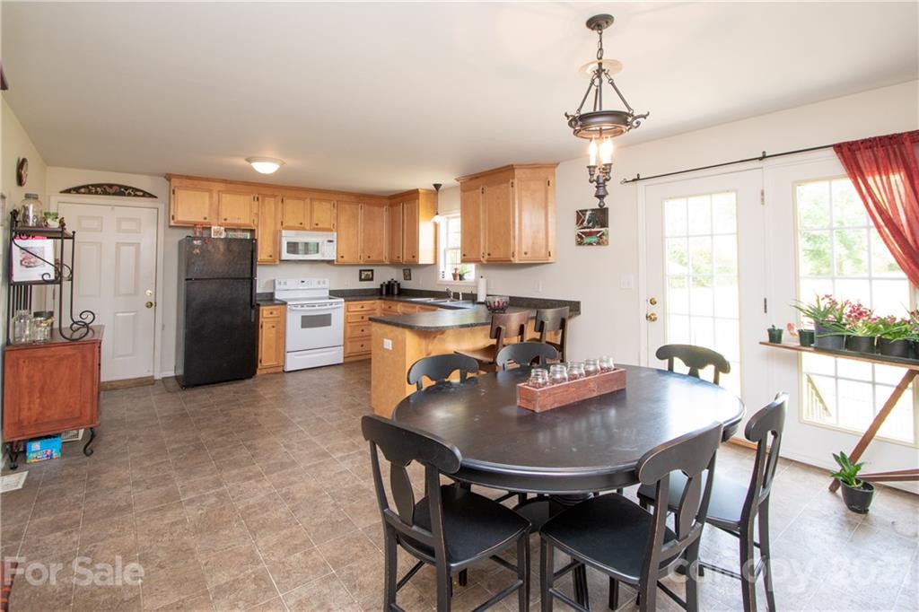 4417 Medlin Road Monroe, NC 28112 - Photo 15 of 30 a dining room with furniture and window