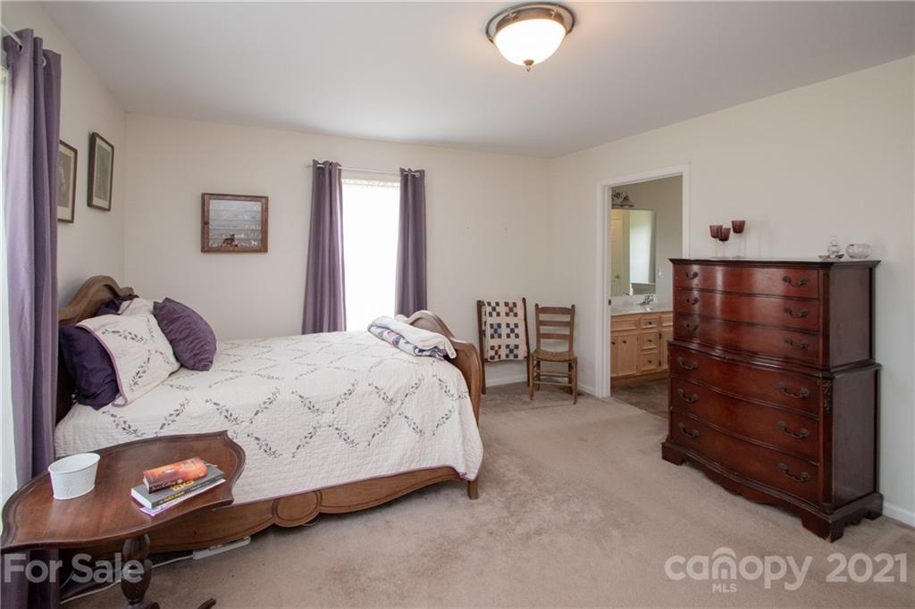 4417 Medlin Road Monroe, NC 28112 - Photo 24 of 30 a bedroom with a bed and a window