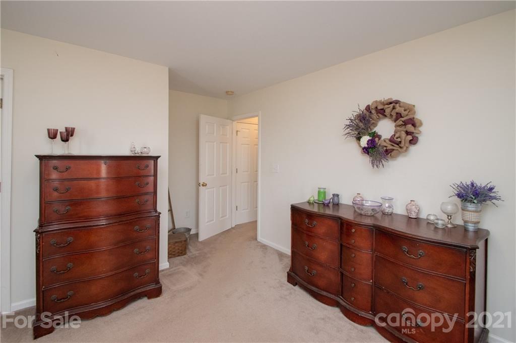 4417 Medlin Road Monroe, NC 28112 - Photo 25 of 30 a room with furniture and wooden floor