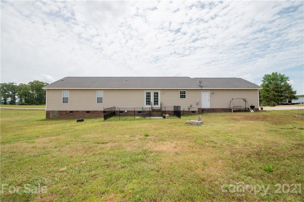4417 Medlin Road Monroe, NC 28112 - Photo 4 of 30 a view of a big yard with an outdoor seating