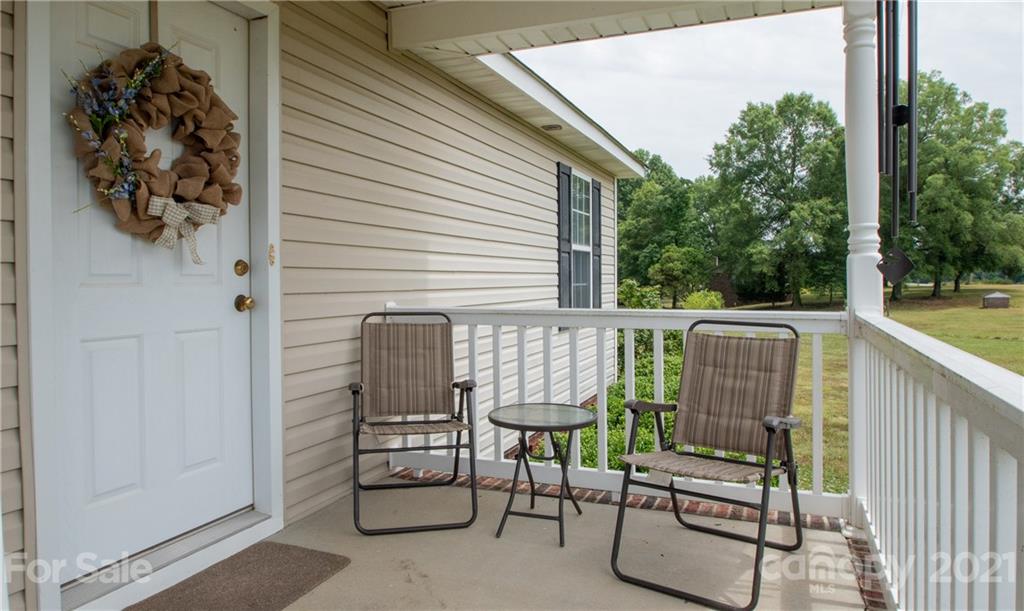4417 Medlin Road Monroe, NC 28112 - Photo 7 of 30 a view of a chair and tables front of the house