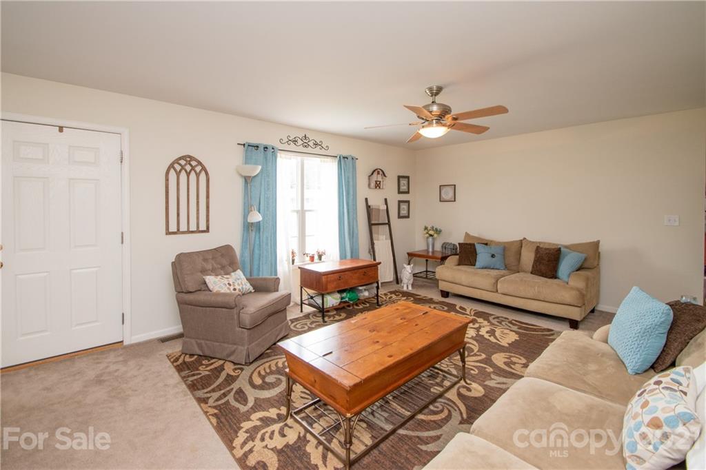4417 Medlin Road Monroe, NC 28112 - Photo 9 of 30 a living room with furniture and a window