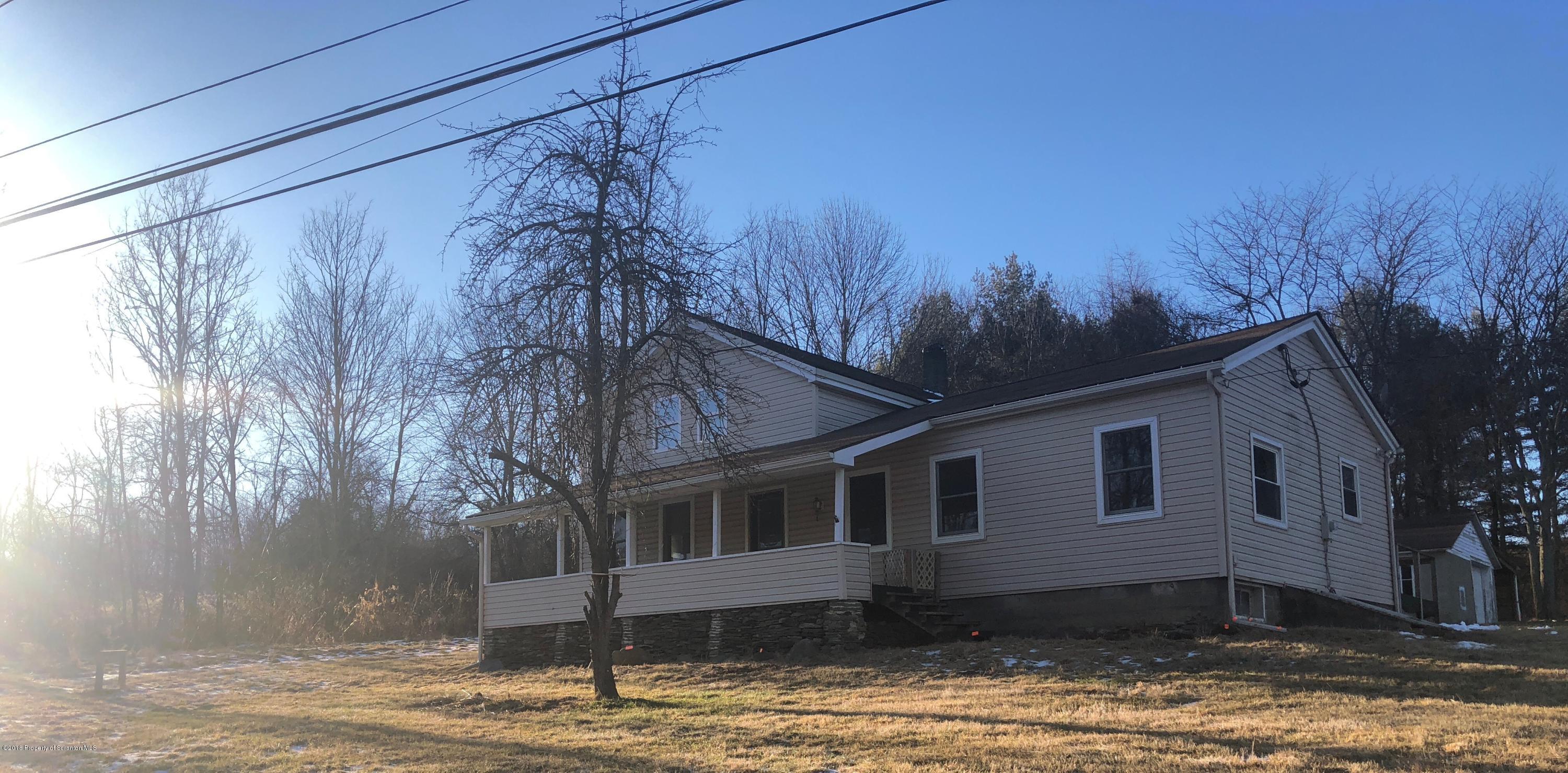 106 Browntown Road Wyalusing, PA 18853 - Photo 1 of 11 a front view of a house with a yard