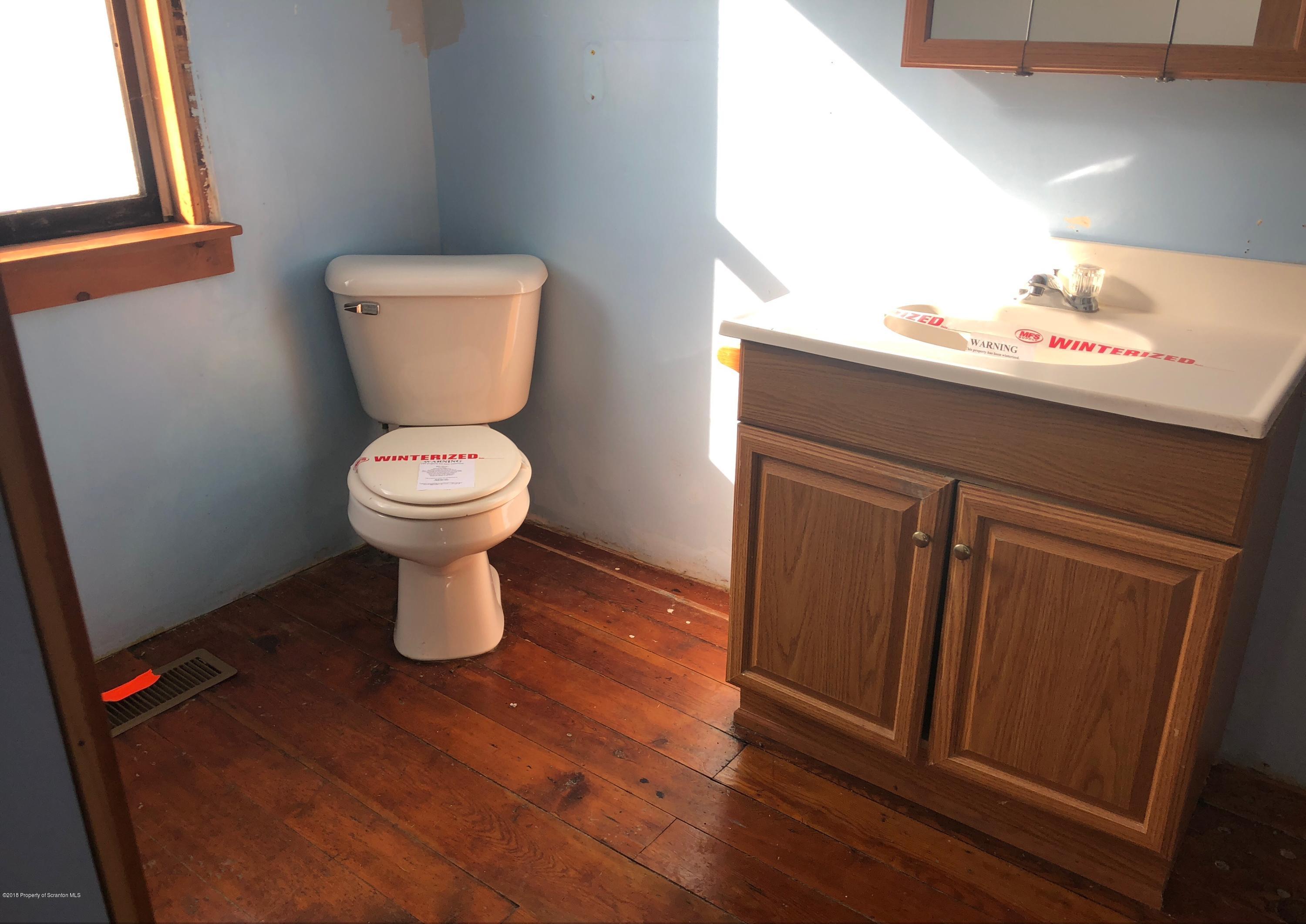 106 Browntown Road Wyalusing, PA 18853 - Photo 4 of 11 a bathroom with a toilet and a sink