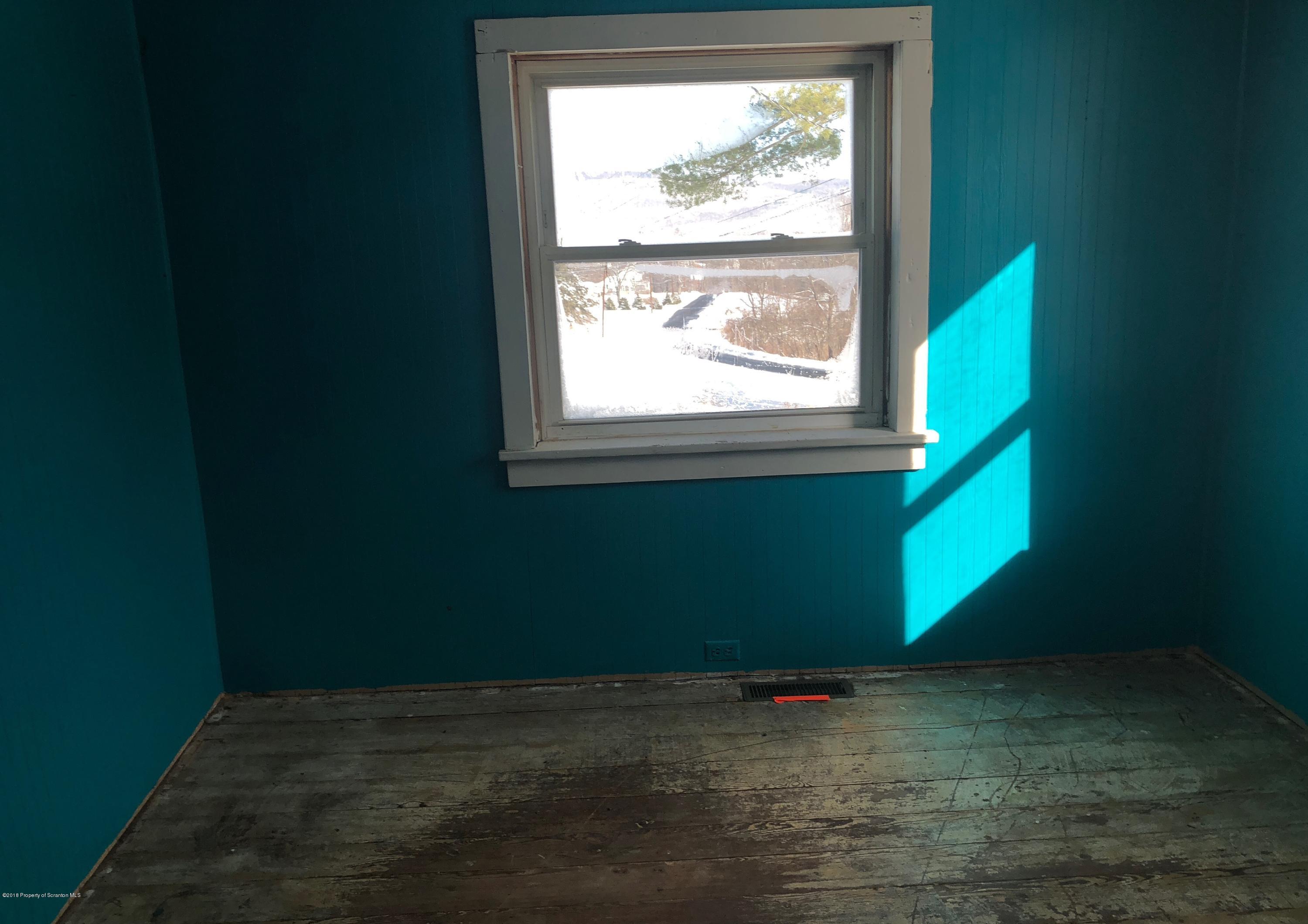 106 Browntown Road Wyalusing, PA 18853 - Photo 5 of 11 a view of a room with wooden floor and a window