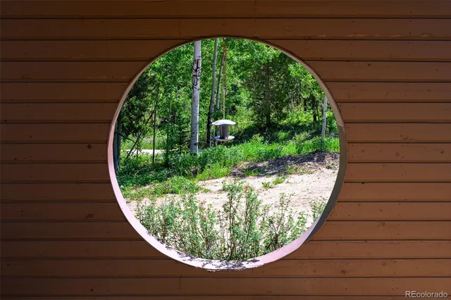 a view of a backyard both side of a house