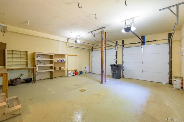 a view of a big room with air conditioner duct and materials on floor