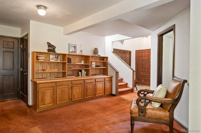 a workspace with furniture and window