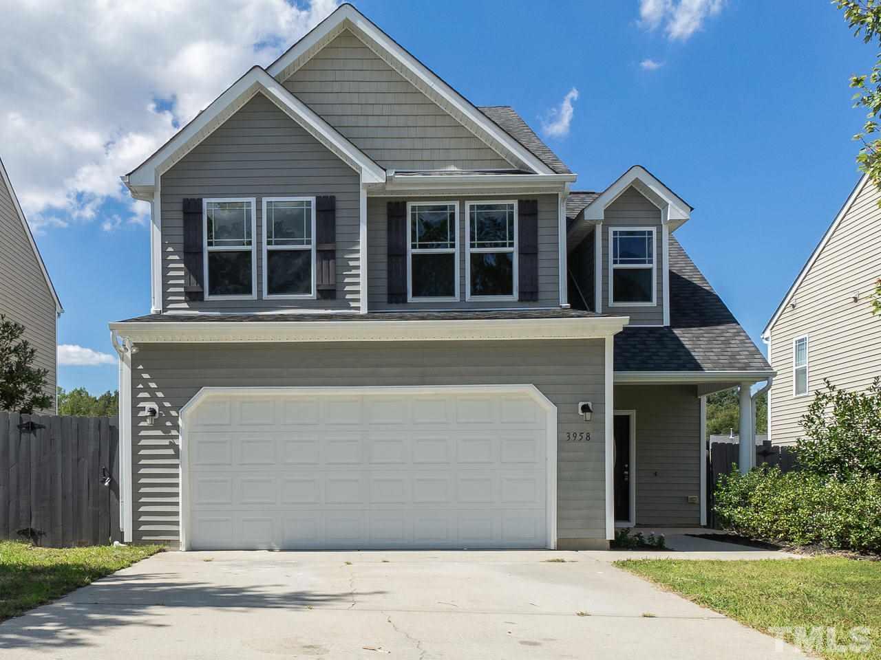 3958 Patriot Ridge Court Raleigh, NC 27610 - Photo 1 of 28 a front view of a house with garden