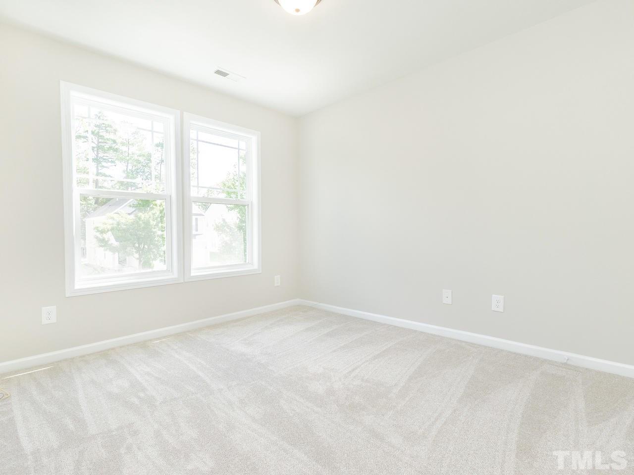 3958 Patriot Ridge Court Raleigh, NC 27610 - Photo 21 of 28 an empty room with a window
