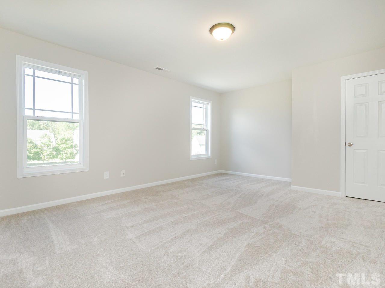 3958 Patriot Ridge Court Raleigh, NC 27610 - Photo 23 of 28 an empty room with windows