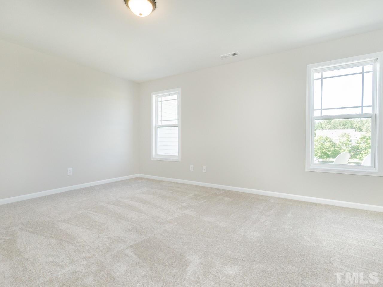 3958 Patriot Ridge Court Raleigh, NC 27610 - Photo 24 of 28 an empty room with windows
