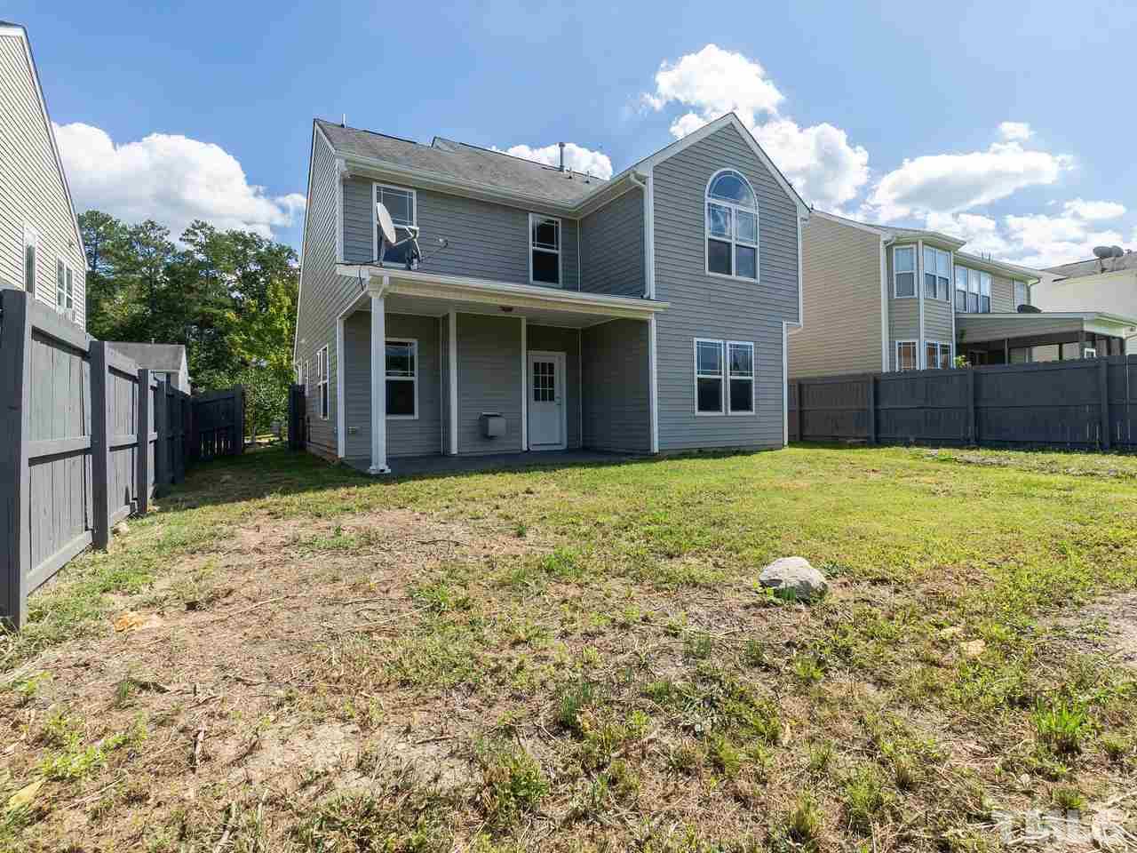 3958 Patriot Ridge Court Raleigh, NC 27610 - Photo 27 of 28 a view of a house with a yard