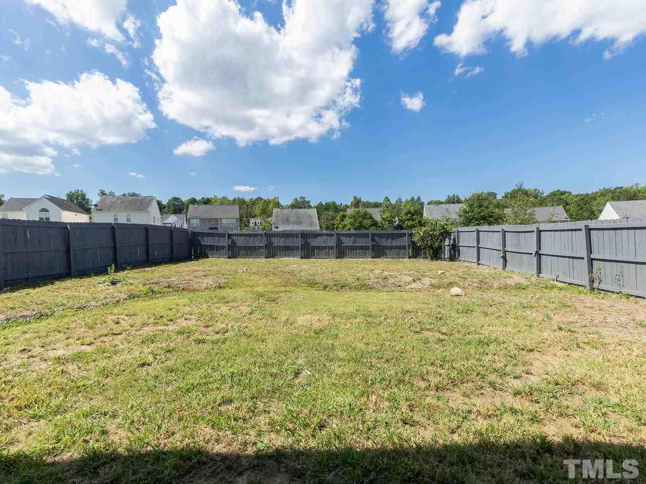 3958 Patriot Ridge Court Raleigh, NC 27610 - Photo 28 of 28 a view of a backyard with a lake view