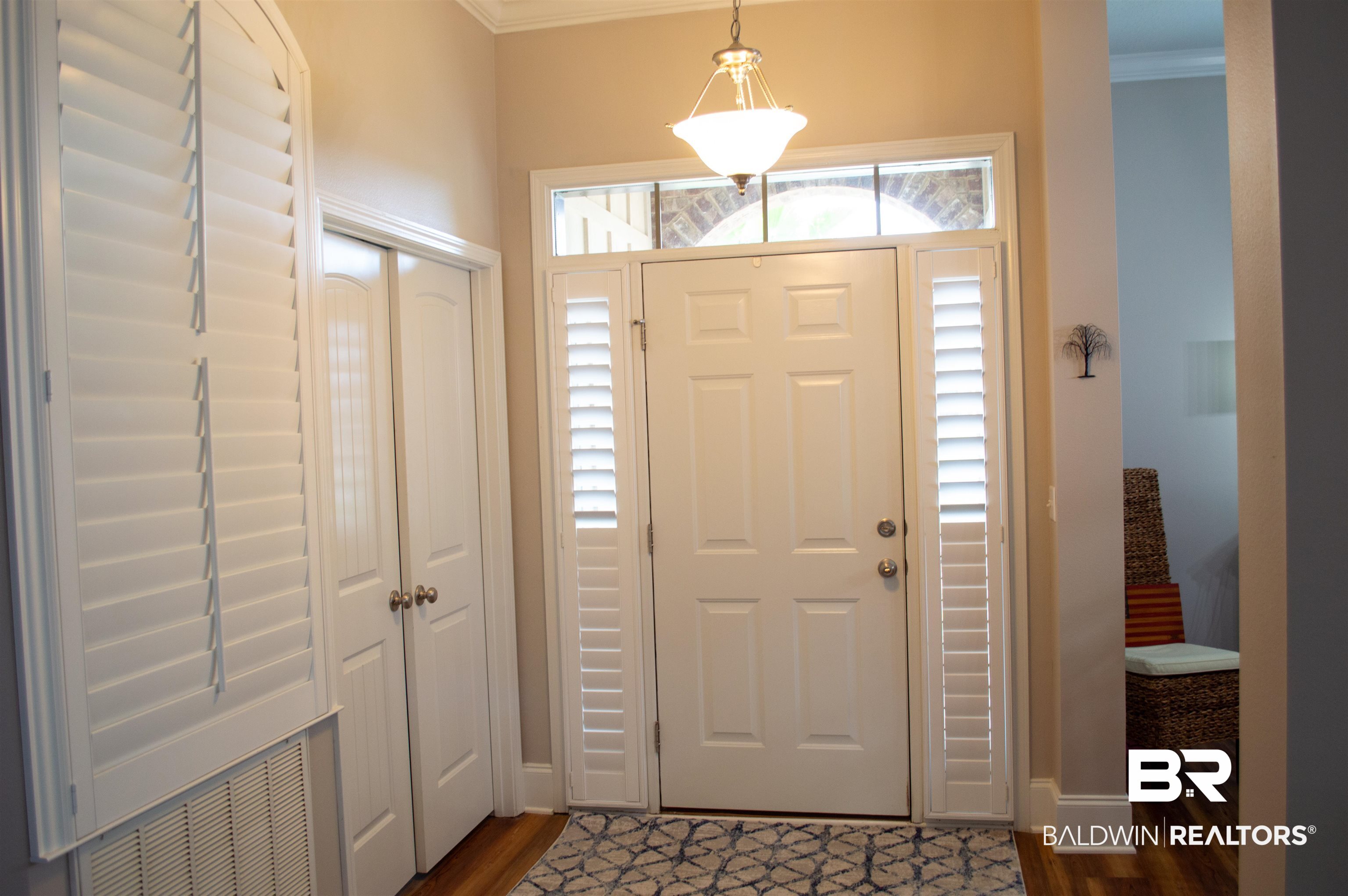 1124 West Orlando Drive Foley, AL 36535 - Photo 5 of 51 Entryway with ornamental molding and dark wood-style flooring