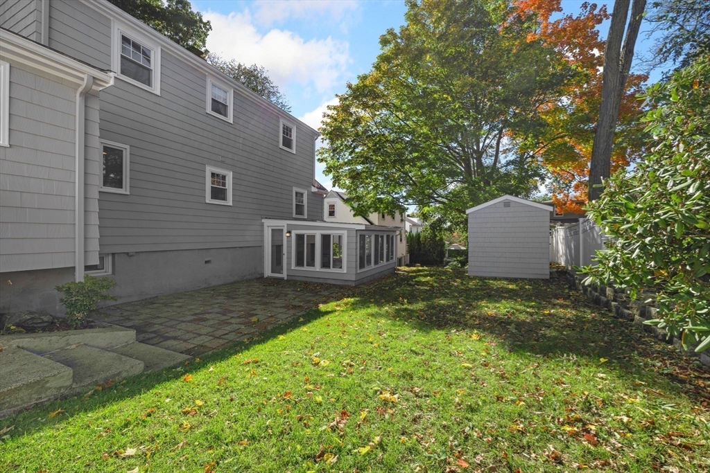 20 Lansdowne Road Arlington, MA 02474 - Photo 30 of 36 a view of a house with a yard and a large tree