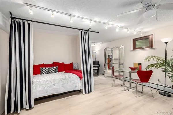 a bedroom with a bed and a couch