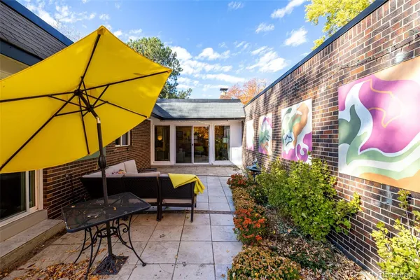 a view of a chairs and table in the patio