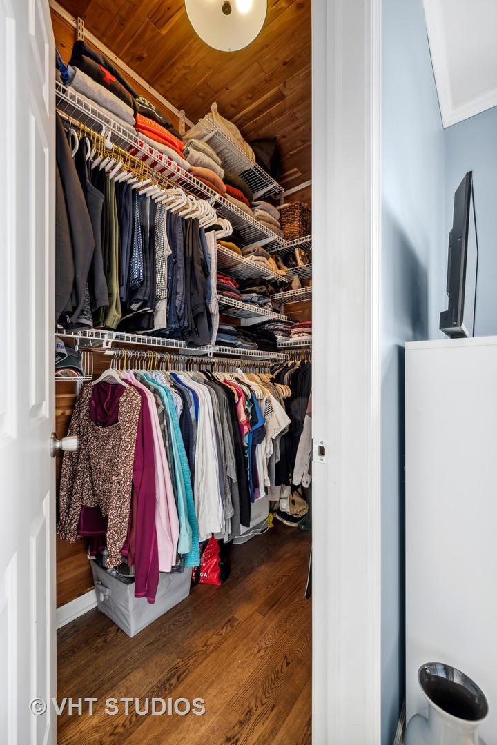 2123 West Rice Street, Unit 3W Chicago, IL 60622 - Photo 11 of 17 a view of walk in closet with clothes and shoes