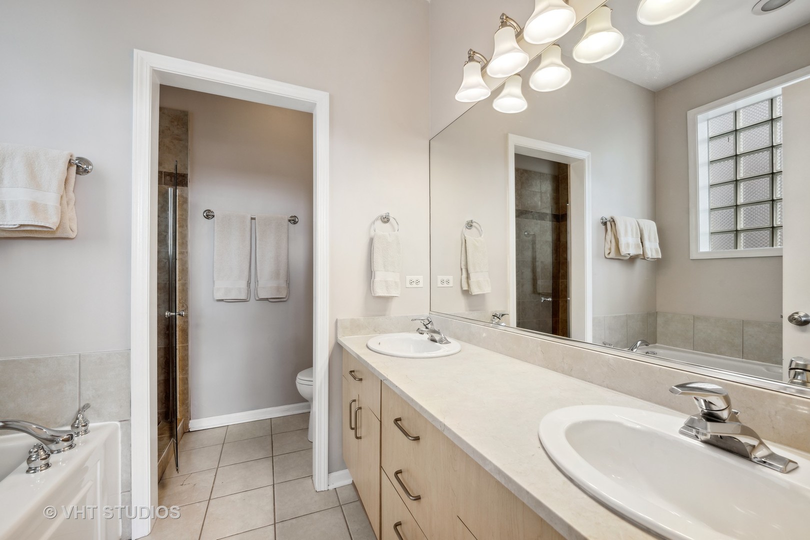 2123 West Rice Street, Unit 3W Chicago, IL 60622 - Photo 12 of 17 a bathroom with a sink vanity and a mirror