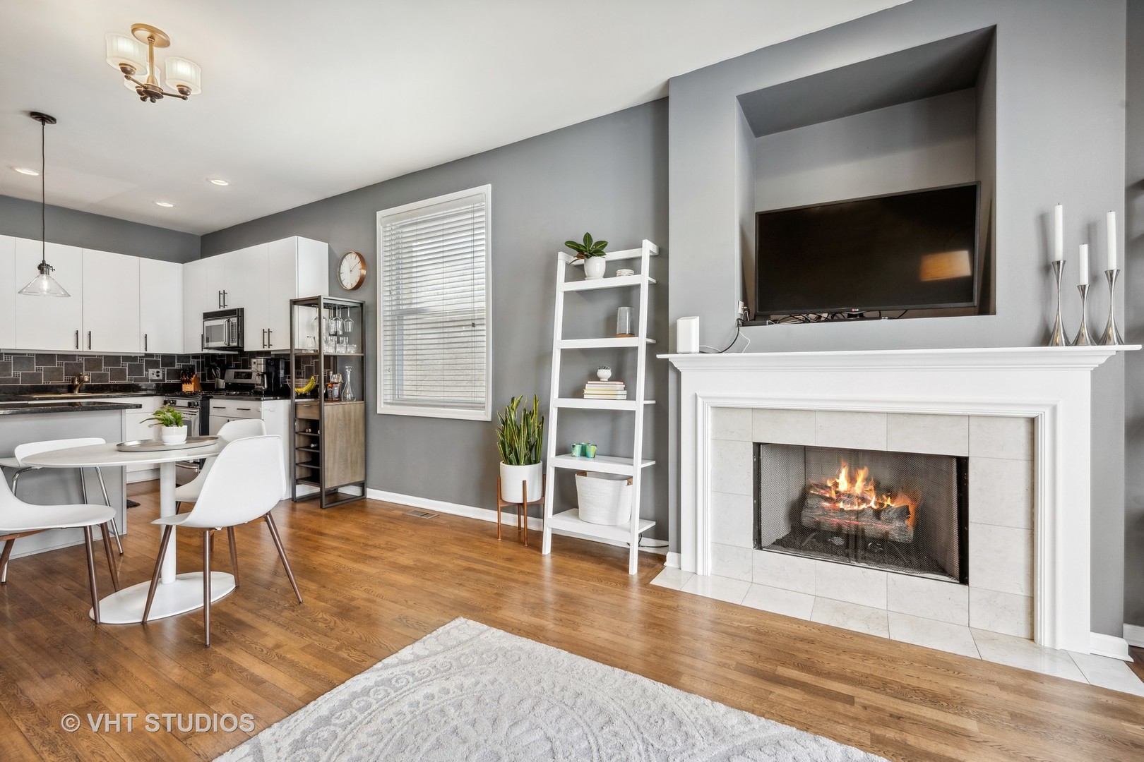 2123 West Rice Street, Unit 3W Chicago, IL 60622 - Photo 6 of 17 a living room with furniture a flat screen tv and a fireplace