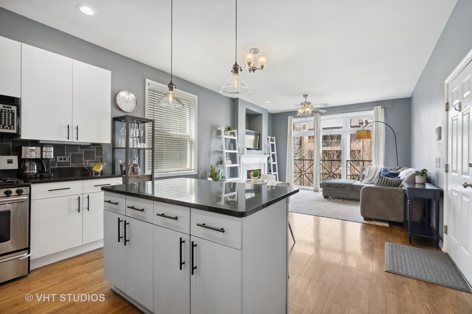 2123 West Rice Street, Unit 3W Chicago, IL 60622 - Photo 9 of 17 a kitchen with stainless steel appliances granite countertop a sink and stove