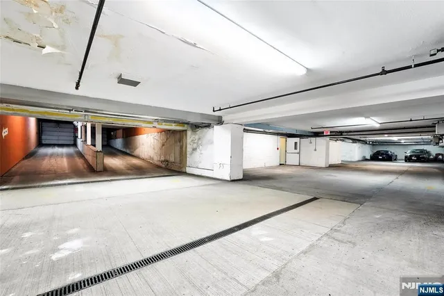 a view of parking garage with car parked
