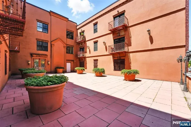 a view of a building with potted plants