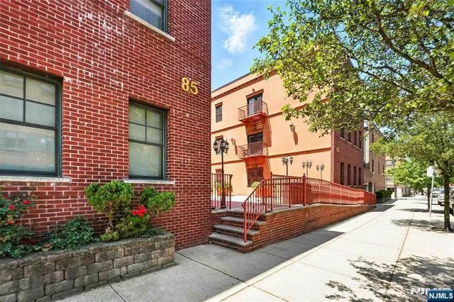 a view of a building with a yard