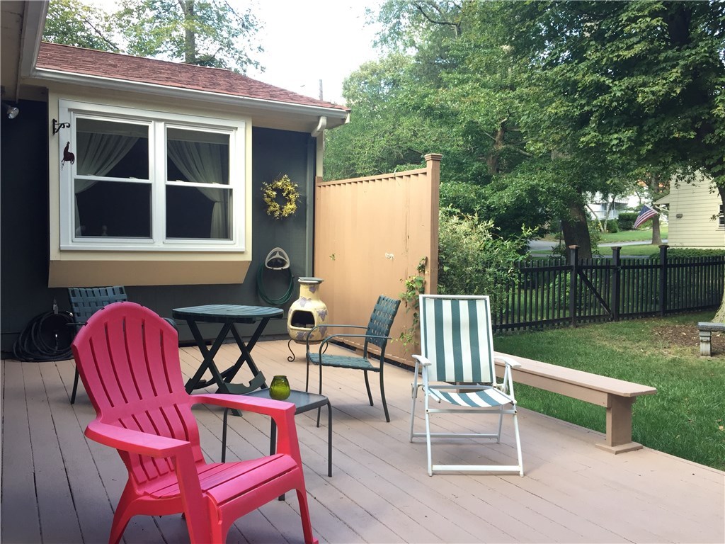 10 Duffield Road Bristol, RI 02809 - Photo 28 of 37 Private sun deck area off the rear of house overlooking private fenced in yard with terrific perennial gardens surrounding.
