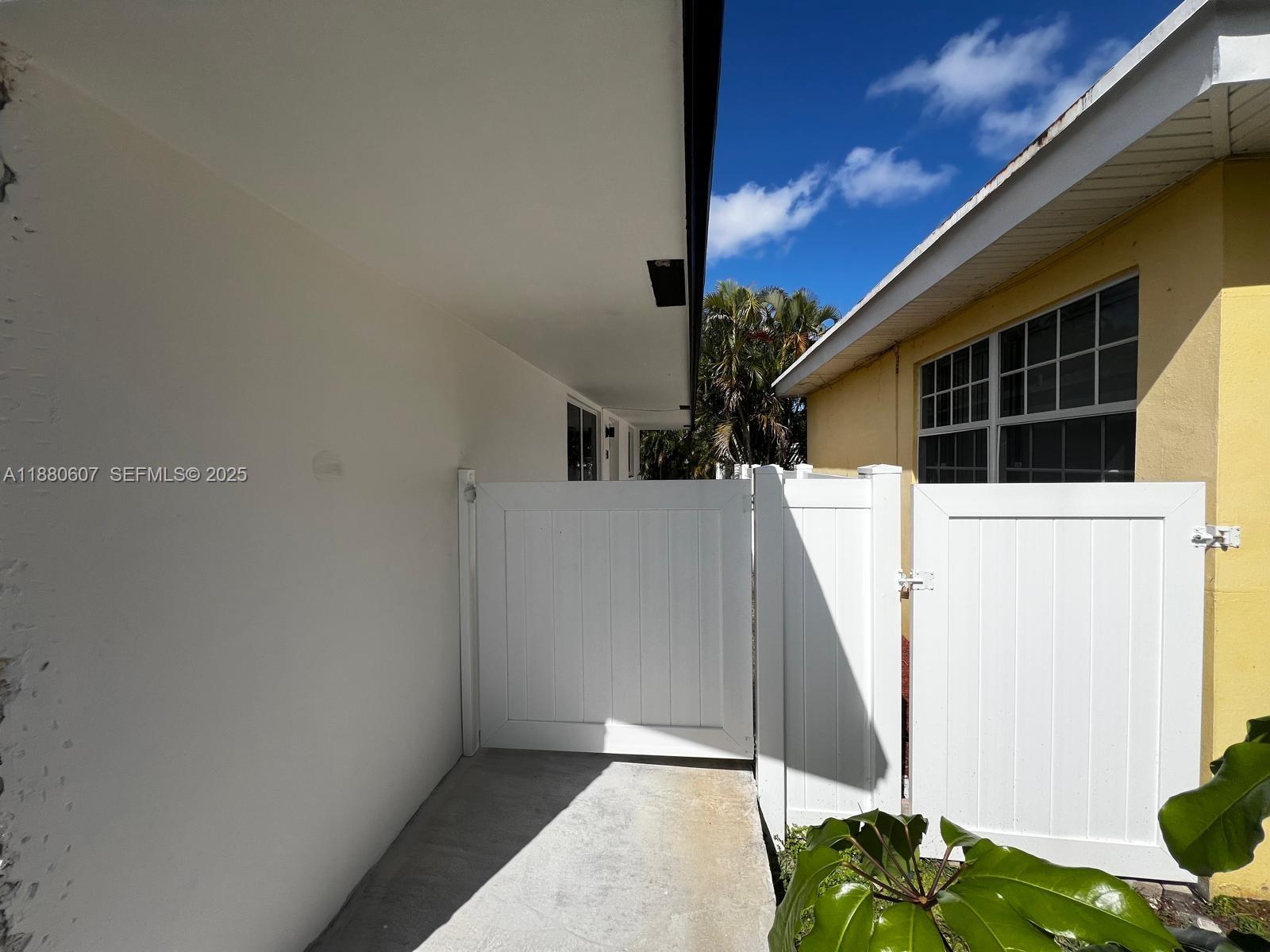 222 Southwest 8th Street, Unit C Dania Beach, FL 33004 - Photo 8 of 10 a view of a house with windows