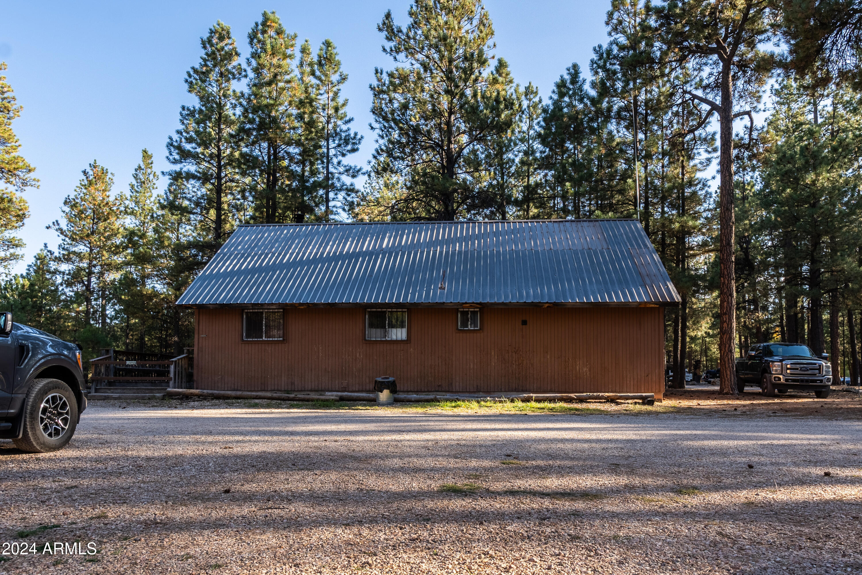 770 Forest Service 461 Road Fredonia, AZ 86022 - Photo 12 of 66 a front view of a house with a garden