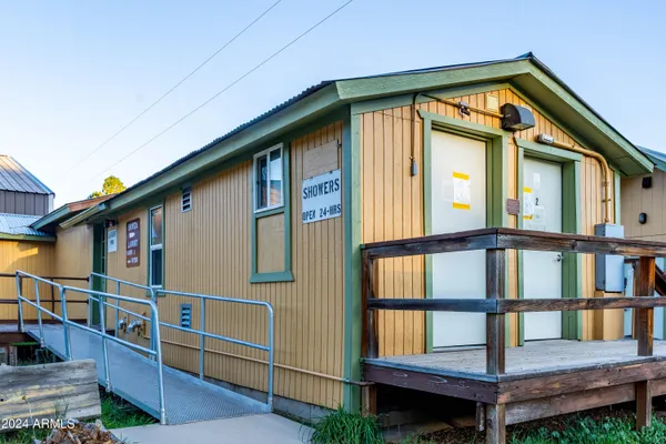 a front view of a house with a yard balcony