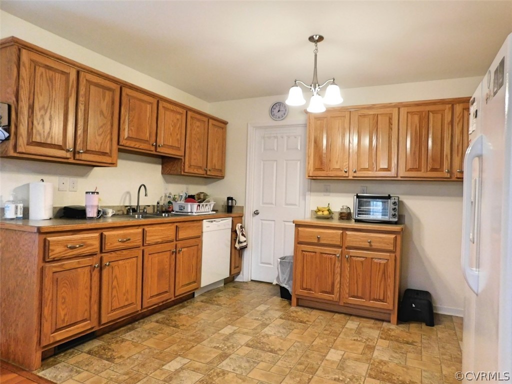 566 Fanny White Road Buckingham, VA 23921 - Photo 3 of 21 a kitchen with stainless steel appliances granite countertop wooden cabinets a stove a sink and dishwasher