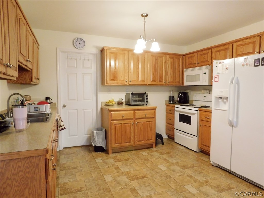 566 Fanny White Road Buckingham, VA 23921 - Photo 4 of 21 a kitchen with white cabinets and white appliances
