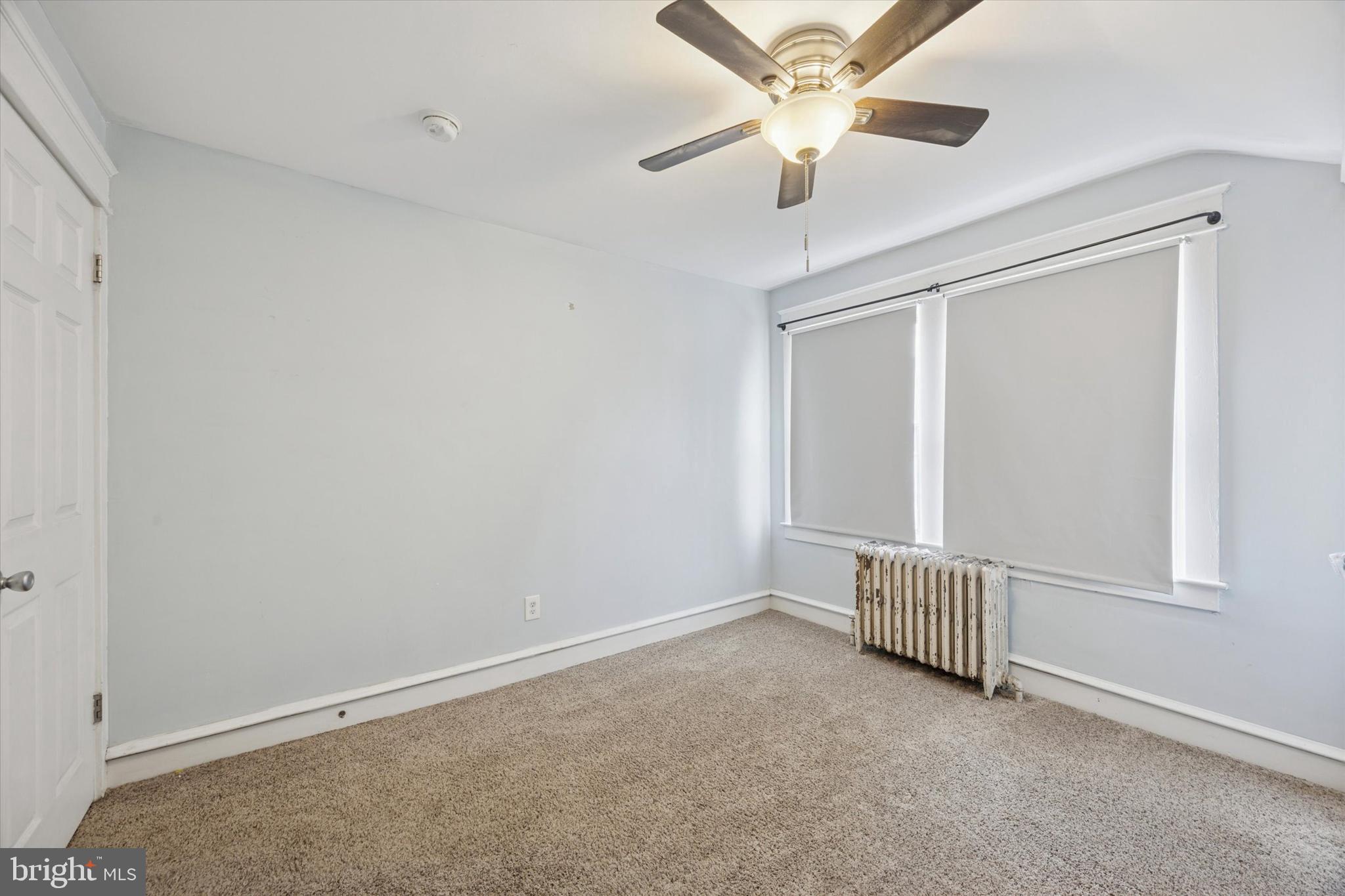 265 West Ridley Avenue Ridley Park, PA 19078 - Photo 13 of 25 an empty room with ceiling fan and window