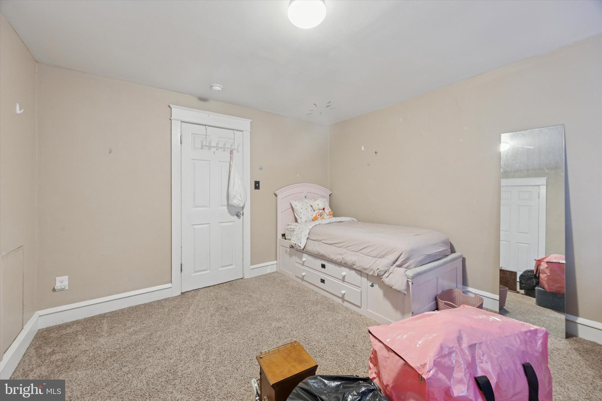 265 West Ridley Avenue Ridley Park, PA 19078 - Photo 18 of 25 a bedroom with a bed and wooden floor