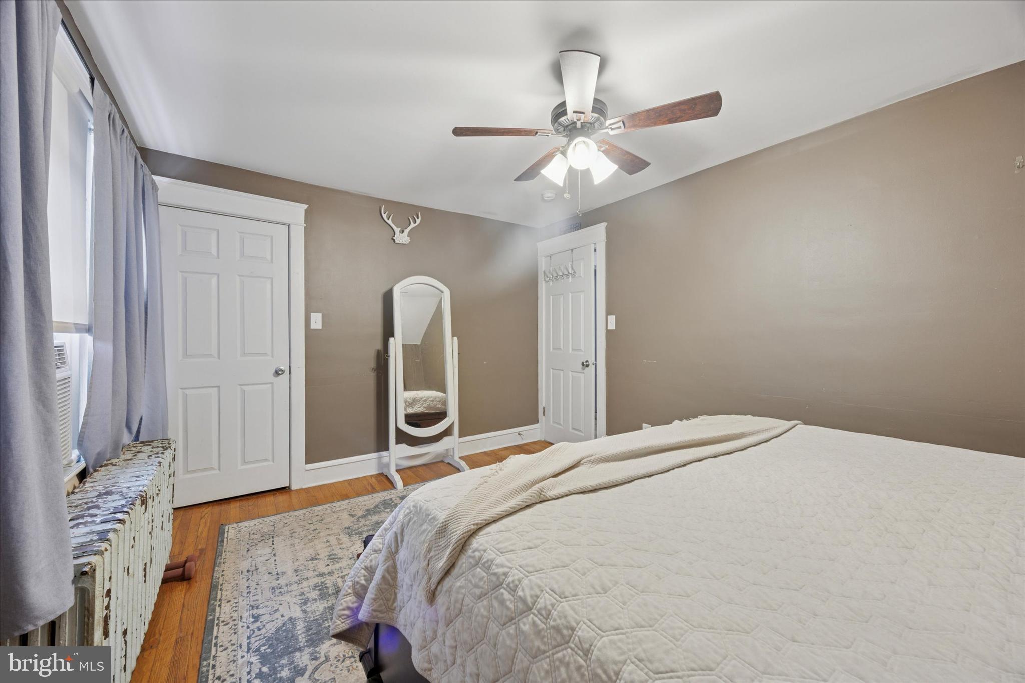 265 West Ridley Avenue Ridley Park, PA 19078 - Photo 21 of 25 a bedroom with a large bed and a chandelier