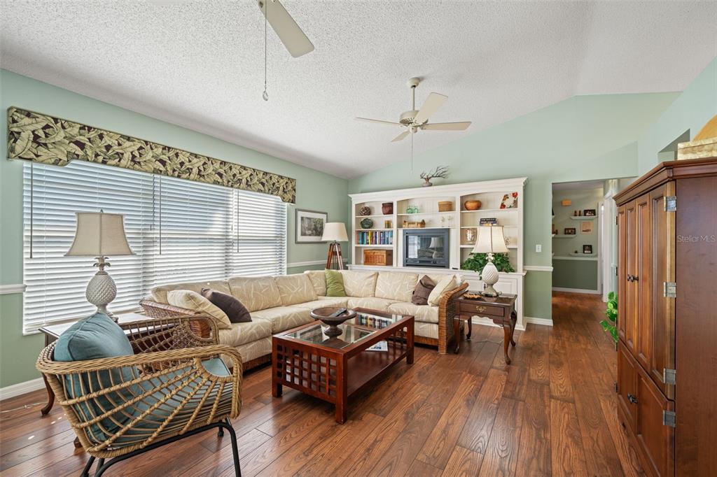 2647 Royal Ridge Drive Spring Hill, FL 34606 - Photo 22 of 73 a living room with furniture and wooden floor