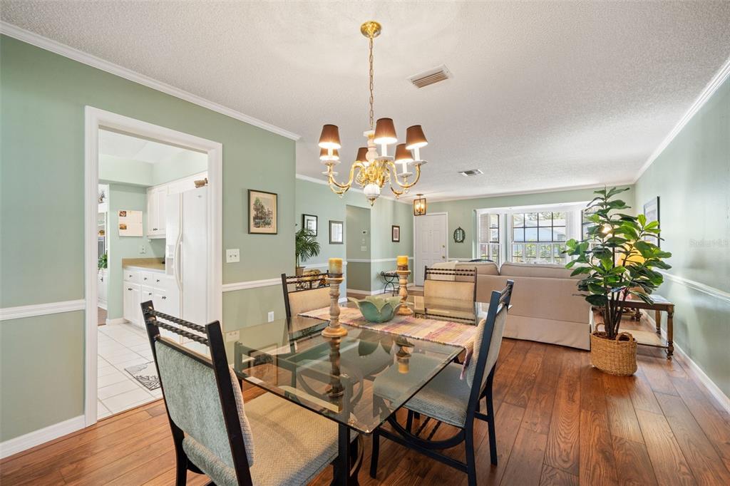 2647 Royal Ridge Drive Spring Hill, FL 34606 - Photo 34 of 73 a view of a dining room with furniture window and wooden floor