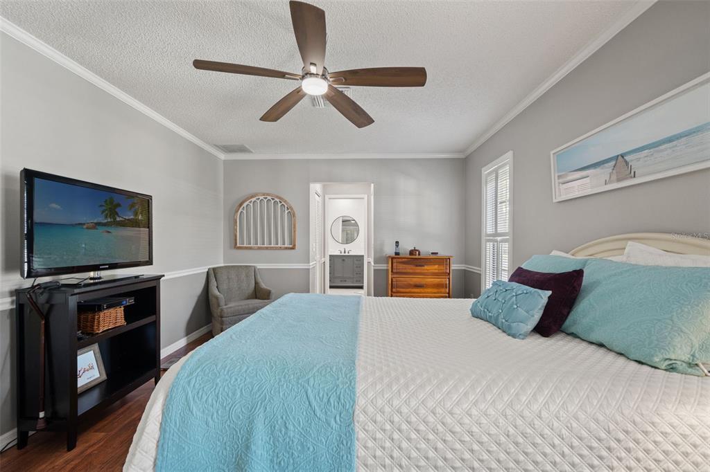 2647 Royal Ridge Drive Spring Hill, FL 34606 - Photo 39 of 73 a bedroom with a bed and a flat screen tv