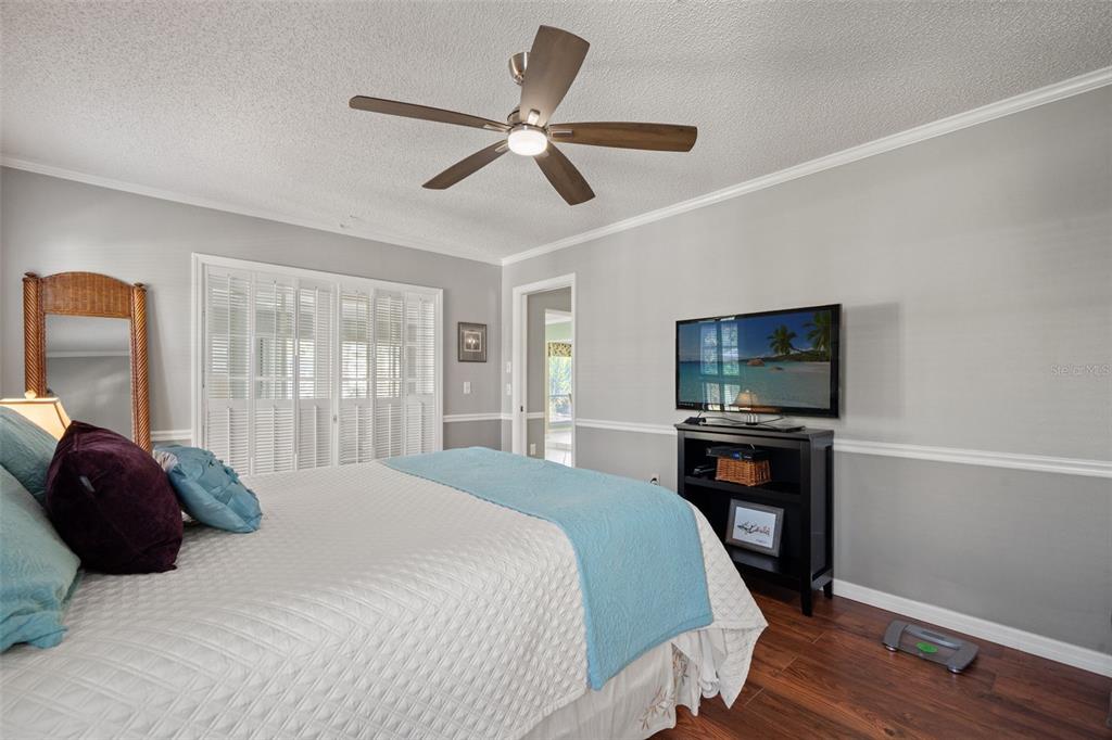 2647 Royal Ridge Drive Spring Hill, FL 34606 - Photo 40 of 73 a bedroom with a bed tv and a window