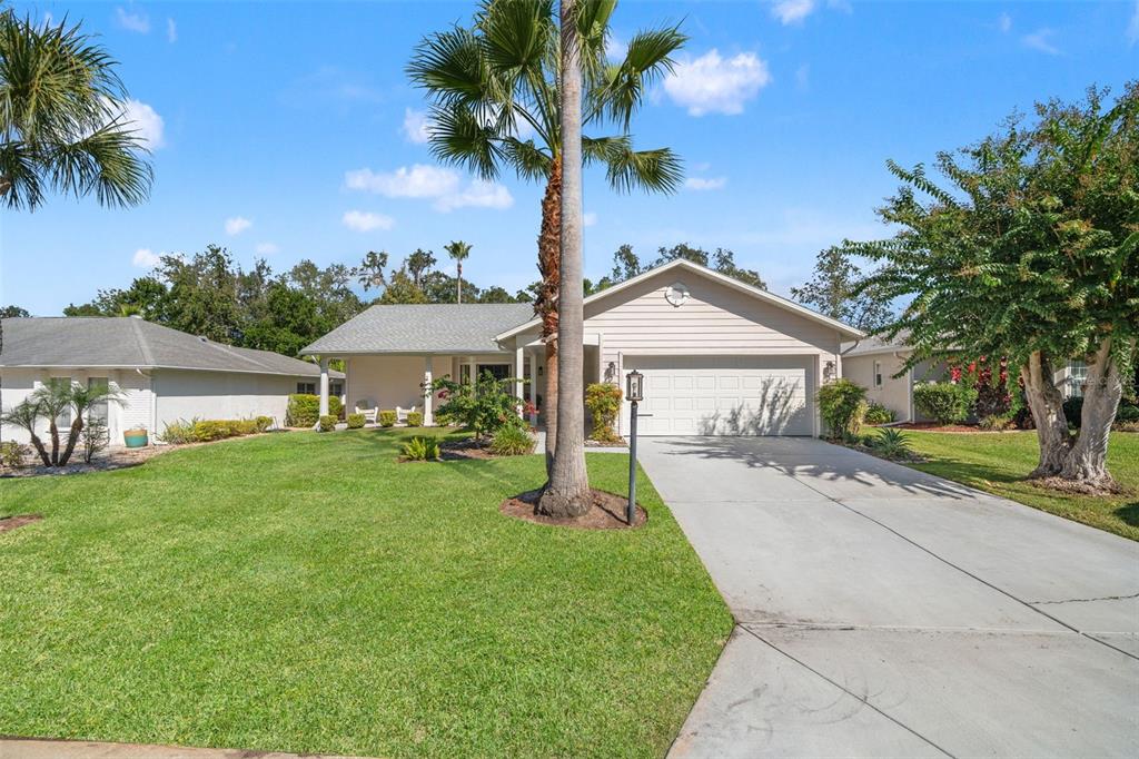 2647 Royal Ridge Drive Spring Hill, FL 34606 - Photo 4 of 73 a front view of a house with garden