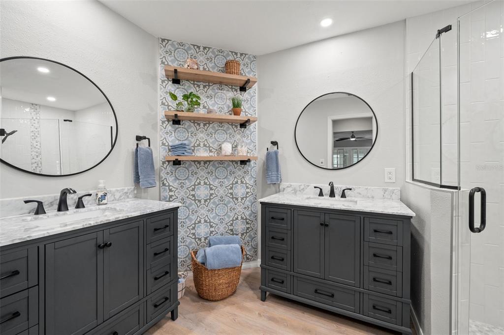2647 Royal Ridge Drive Spring Hill, FL 34606 - Photo 42 of 73 a bathroom with a double vanity sink double and mirror